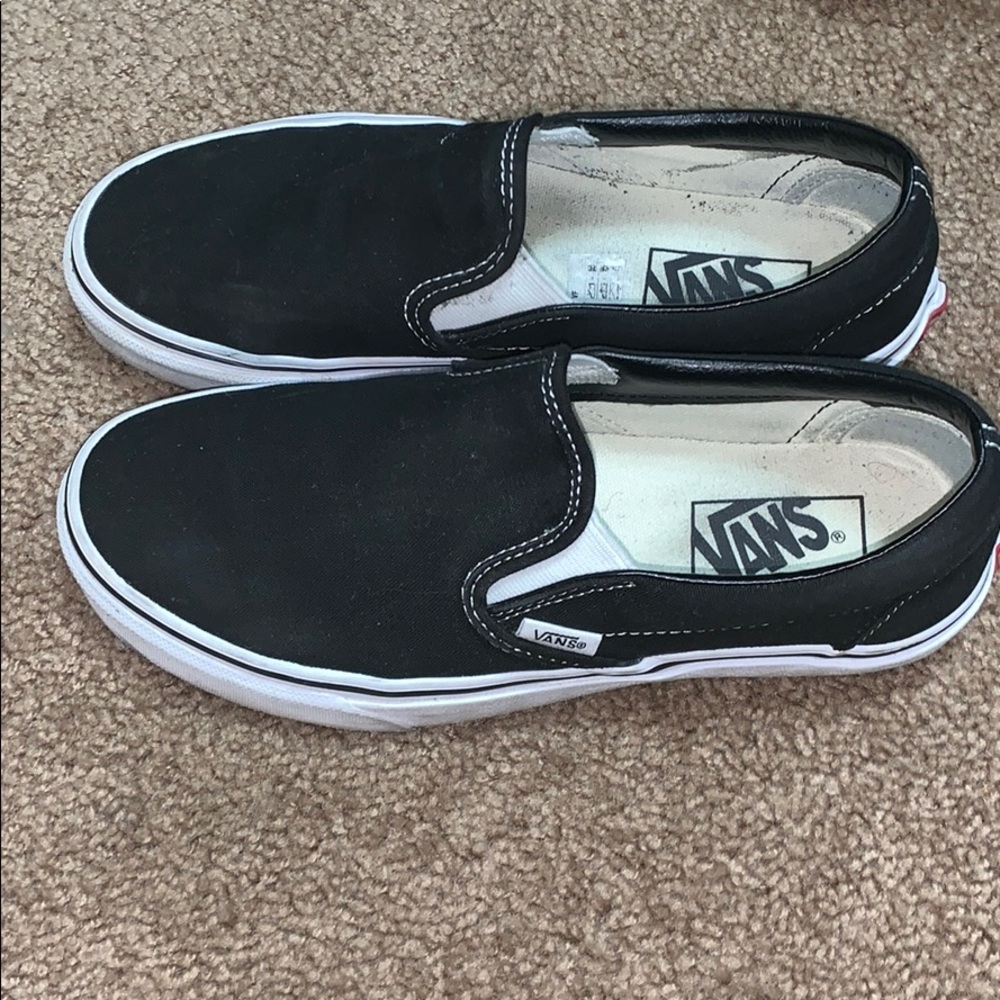 Black slip on vans.